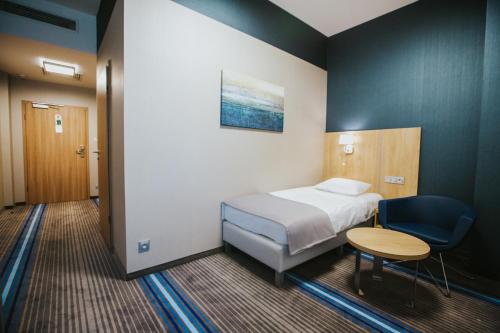 Imagen de la habitación del Hotel Radocza Park Business. Foto 7