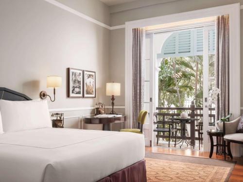 Imagen de la habitación del Hotel Raffles Le Royal. Foto 16