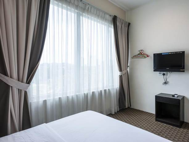 Imagen de la habitación del Hotel Raintree. Foto 7