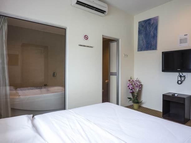 Imagen de la habitación del Hotel Raintree. Foto 9