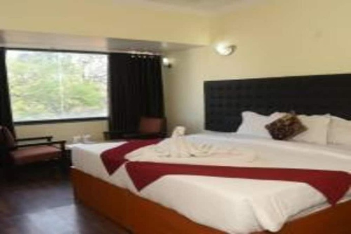 Imagen de la habitación del Hotel Rajhans International. Foto 8