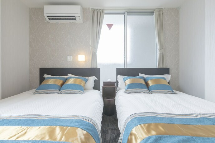Imagen de la habitación del Hotel Rakuraku Inn Miyabi. Foto 18