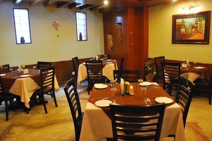 Imagen del bar/restaurante del Hotel Rama Inn Boutique Home. Foto 3