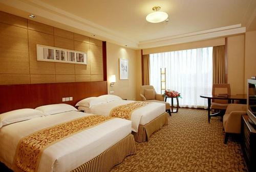 Imagen de la habitación del Hotel Ramada Beijing North. Foto 7