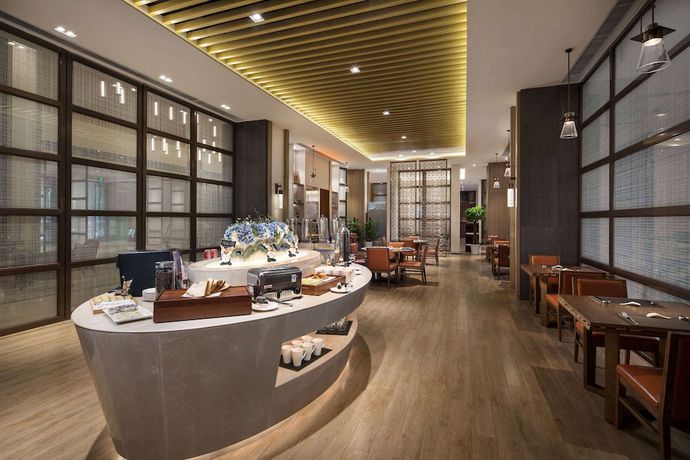 Imagen del bar/restaurante del Hotel Ramada By Wyndham Baoji Jintai. Foto 3