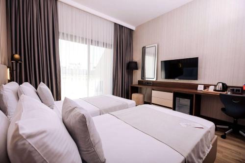 Imagen de la habitación del Hotel Ramada By Wyndham Cesme. Foto 4