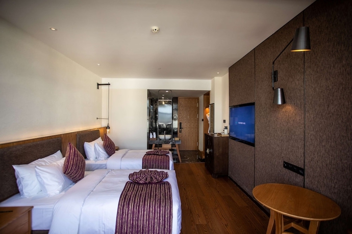 Imagen de la habitación del Hotel Ramada By Wyndham Diqing. Foto 5