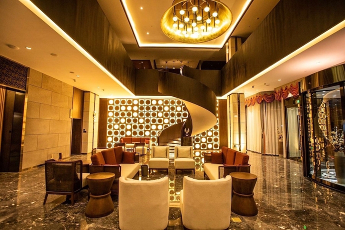 Imagen de los interiores del Hotel Ramada By Wyndham Diqing. Foto 9