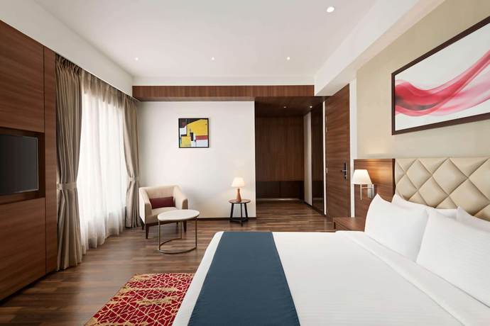 Imagen de la habitación del Hotel Ramada By Wyndham Gandhidham Shinay. Foto 2