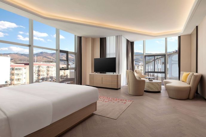 Imagen de la habitación del Hotel Ramada By Wyndham Honghe Kaiyuan. Foto 1