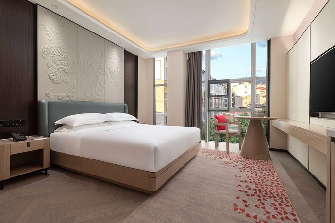 Imagen de la habitación del Hotel Ramada By Wyndham Honghe Kaiyuan. Foto 8