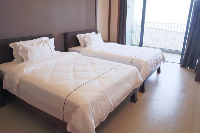 Imagen de la habitación del Hotel Ramada By Wyndham Huizhou Xunliao Bay. Foto 10