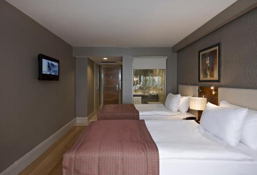 Imagen de la habitación del Hotel Ramada By Wyndham Istanbul Grand Bazaar. Foto 5