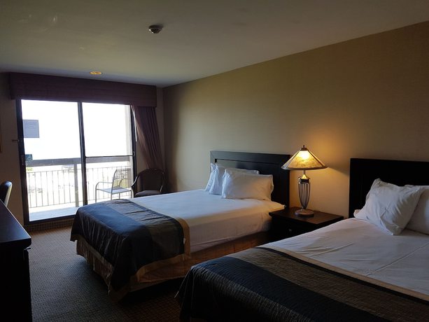 Imagen de la habitación del Hotel Ramada By Wyndham Jordan/beacon Harbourside Resort. Foto 11
