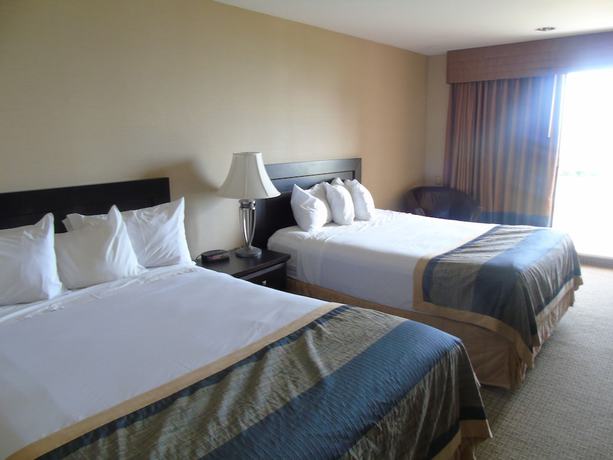 Imagen de la habitación del Hotel Ramada By Wyndham Jordan/beacon Harbourside Resort. Foto 13