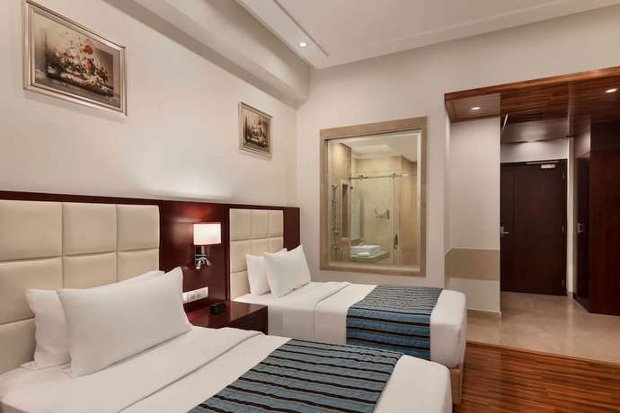 Imagen de la habitación del Hotel Ramada By Wyndham New Delhi Pitampura. Foto 13