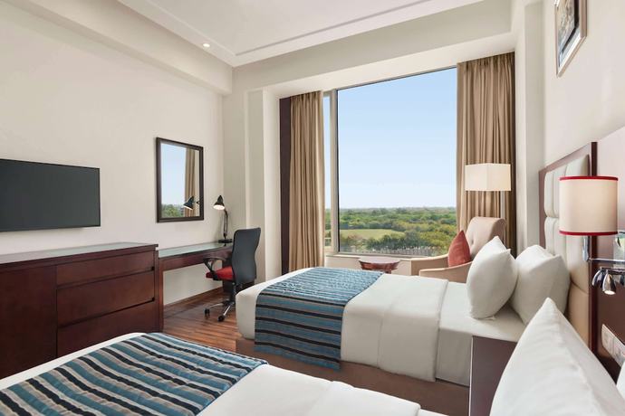 Imagen de la habitación del Hotel Ramada By Wyndham New Delhi Pitampura. Foto 15