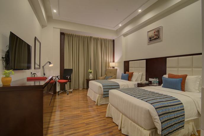Imagen de la habitación del Hotel Ramada By Wyndham New Delhi Pitampura. Foto 17