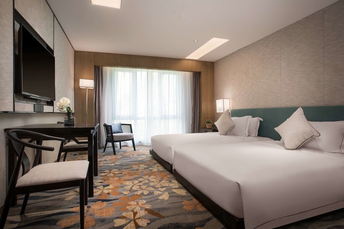 Imagen de la habitación del Hotel Ramada By Wyndham Zhenjiang City Center. Foto 8