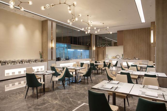 Imagen del bar/restaurante del Hotel Ramada Encore By Wyndham Dongguan East. Foto 4