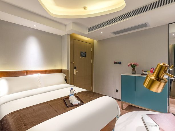 Imagen de la habitación del Hotel Ramada Encore By Wyndham Guangzhou Jiangnanxi. Foto 5