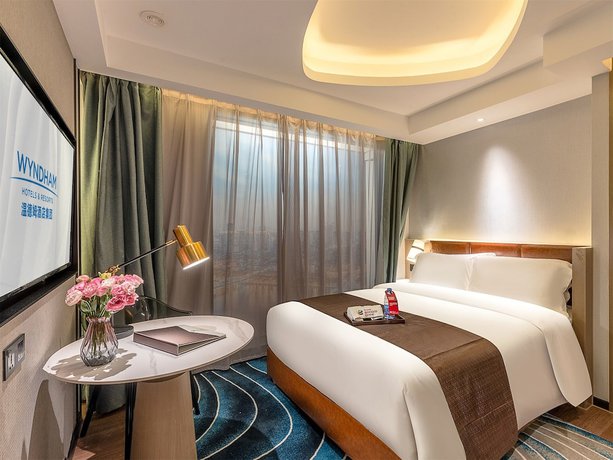Imagen de la habitación del Hotel Ramada Encore By Wyndham Guangzhou Jiangnanxi. Foto 6