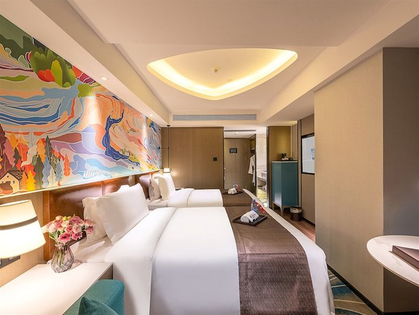 Imagen de la habitación del Hotel Ramada Encore By Wyndham Guangzhou Jiangnanxi. Foto 7