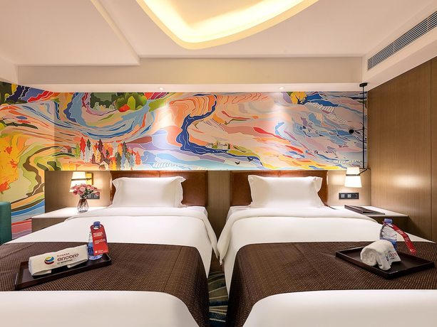 Imagen de la habitación del Hotel Ramada Encore By Wyndham Guangzhou Jiangnanxi. Foto 10