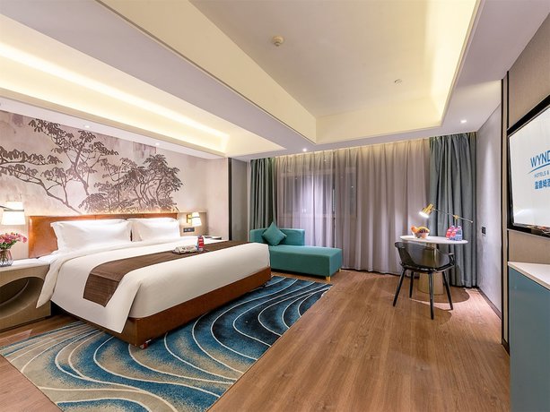 Imagen de la habitación del Hotel Ramada Encore By Wyndham Guangzhou Jiangnanxi. Foto 11