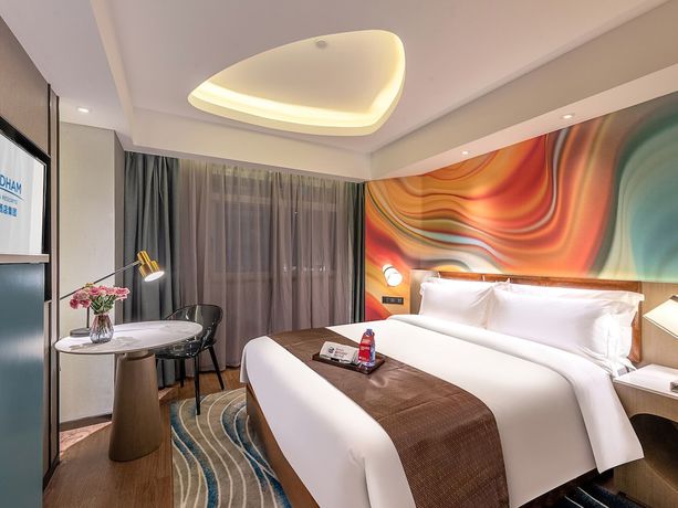 Imagen de la habitación del Hotel Ramada Encore By Wyndham Guangzhou Jiangnanxi. Foto 18