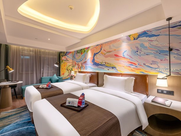 Imagen de la habitación del Hotel Ramada Encore By Wyndham Guangzhou Jiangnanxi. Foto 20