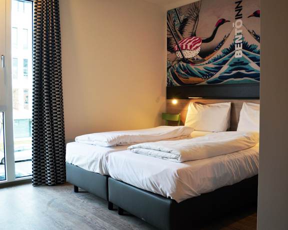 Imagen de la habitación del Hotel Ramada Encore By Wyndham Munich Messe. Foto 6