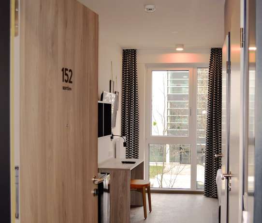 Imagen de la habitación del Hotel Ramada Encore By Wyndham Munich Messe. Foto 7