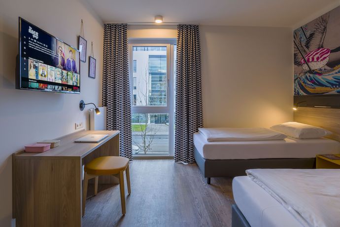 Imagen de la habitación del Hotel Ramada Encore By Wyndham Munich Messe. Foto 11