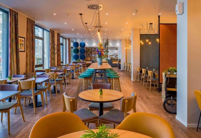 Imagen de los interiores del Hotel Ramada Encore By Wyndham Munich Messe. Foto 14