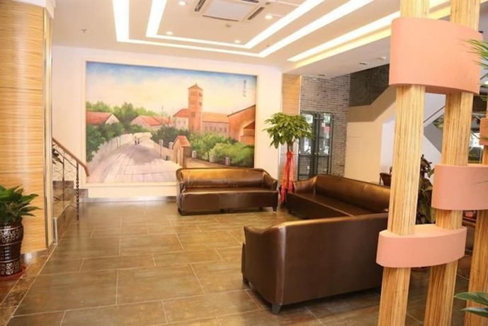 Imagen de los interiores del Hotel Ramada Encore By Wyndham Qingdao Shinan. Foto 16