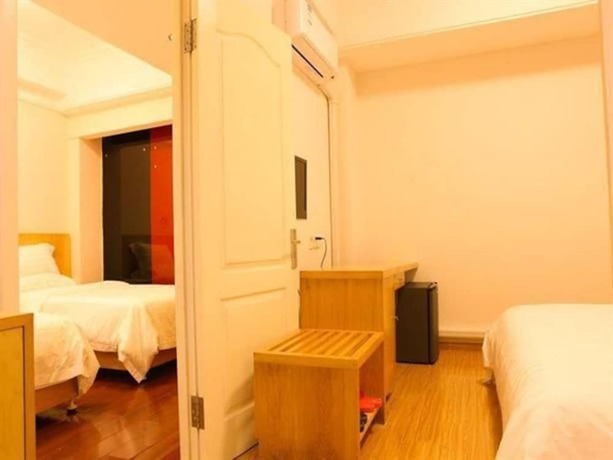 Imagen de la habitación del Hotel Ramada Encore By Wyndham Qingdao Shinan. Foto 3