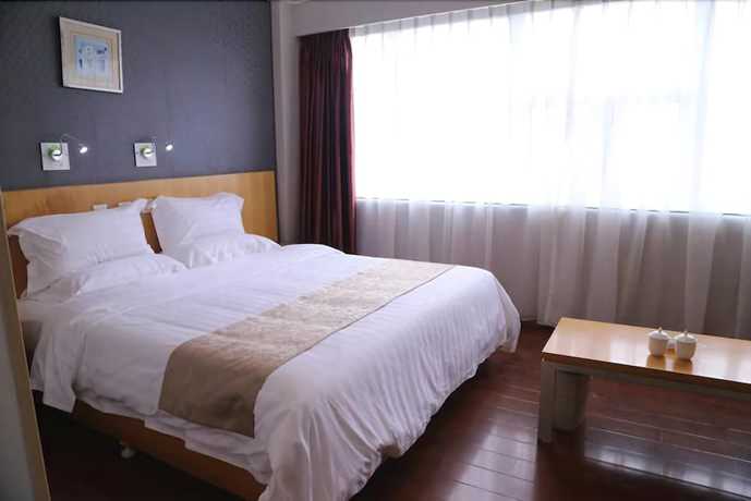 Imagen de la habitación del Hotel Ramada Encore By Wyndham Qingdao Shinan. Foto 5