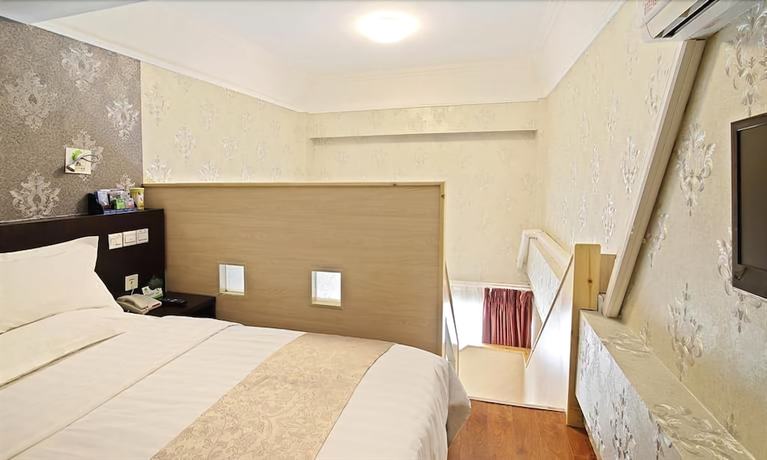 Imagen de la habitación del Hotel Ramada Encore By Wyndham Qingdao Shinan. Foto 7