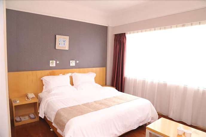 Imagen de la habitación del Hotel Ramada Encore By Wyndham Qingdao Shinan. Foto 8
