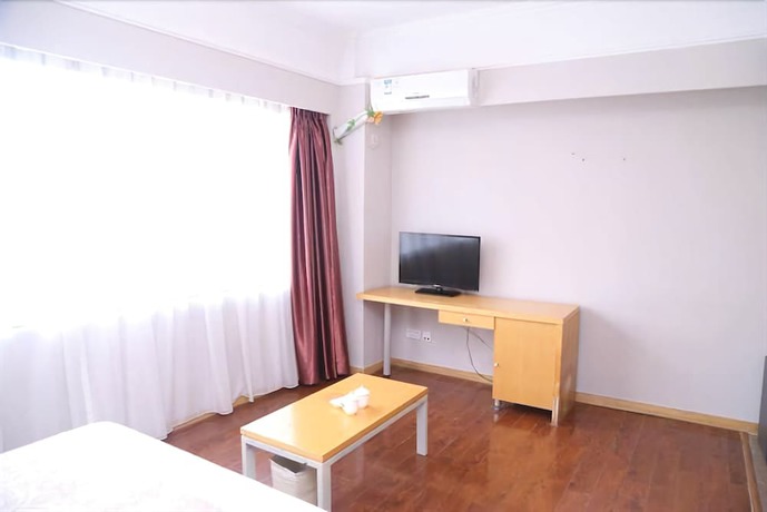 Imagen de la habitación del Hotel Ramada Encore By Wyndham Qingdao Shinan. Foto 10