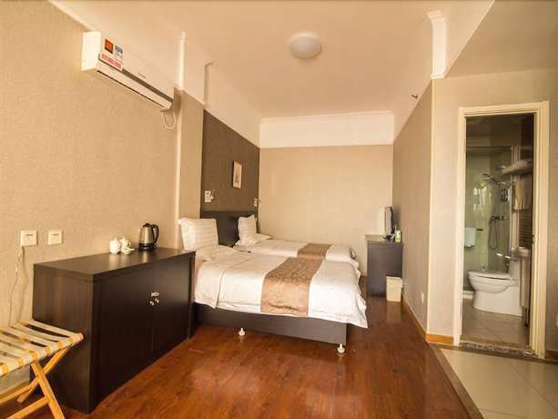 Imagen de la habitación del Hotel Ramada Encore By Wyndham Qingdao Shinan. Foto 11