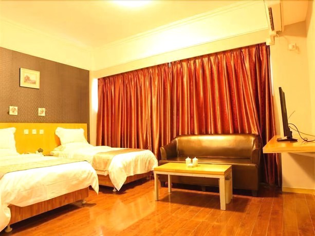 Imagen de la habitación del Hotel Ramada Encore By Wyndham Qingdao Shinan. Foto 12