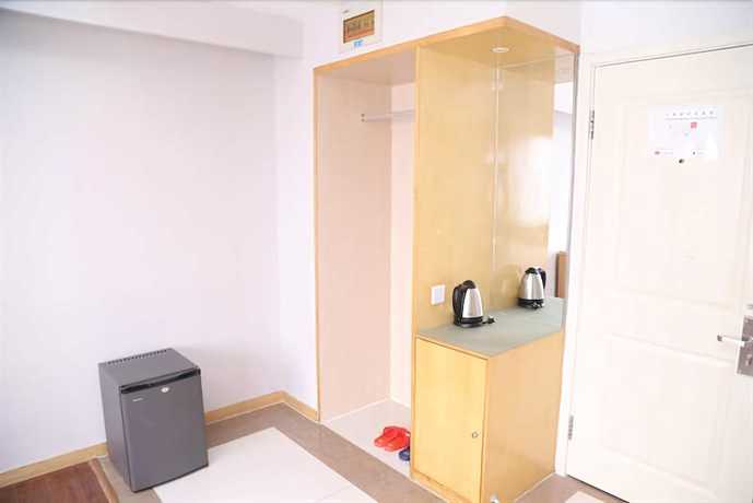 Imagen de la habitación del Hotel Ramada Encore By Wyndham Qingdao Shinan. Foto 13