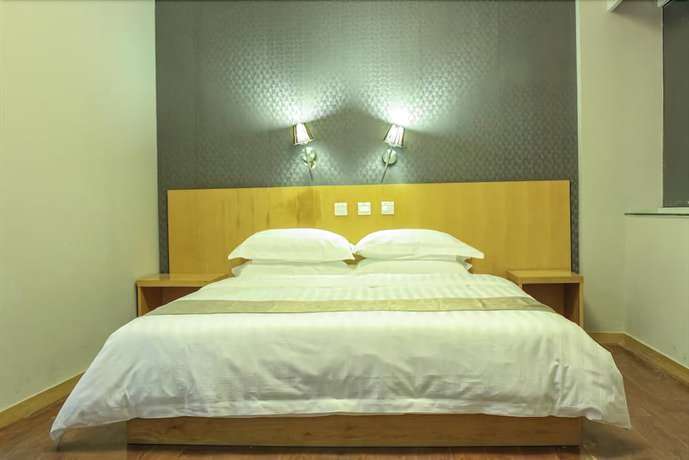 Imagen de la habitación del Hotel Ramada Encore By Wyndham Qingdao Shinan. Foto 14