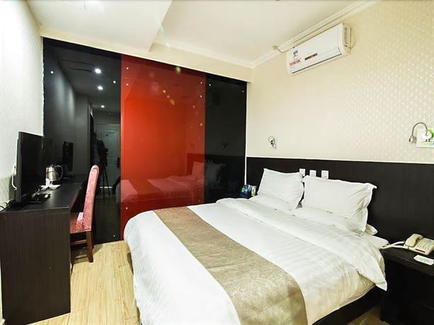 Imagen de la habitación del Hotel Ramada Encore By Wyndham Qingdao Shinan. Foto 15