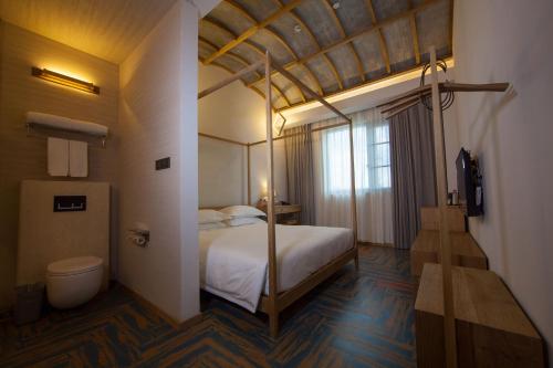 Imagen de la habitación del Hotel Ramada Encore By Wyndham Shanghai Pudong Airport. Foto 6