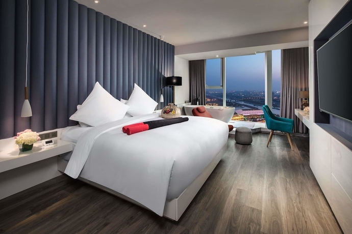 Imagen de la habitación del Hotel Ramada Encore By Wyndham Yangzhoudong Railway Station. Foto 3