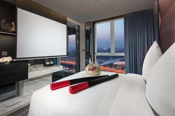Imagen de la habitación del Hotel Ramada Encore By Wyndham Yangzhoudong Railway Station. Foto 4