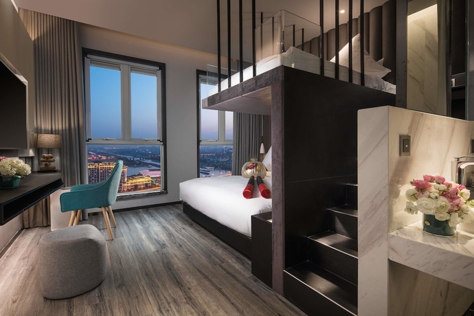 Imagen de la habitación del Hotel Ramada Encore By Wyndham Yangzhoudong Railway Station. Foto 9